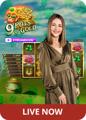 Female game presenter in front of the slots from 9 Pots of Gold with the logo on the top left, and 'Live Now' on the bottom.