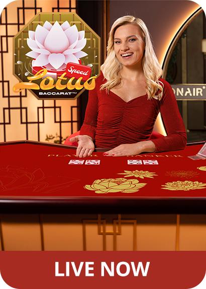 Female game presenter behind a game table presenting cards, featuring the logo of Lotus Speed Baccarat and 'Live Now'.