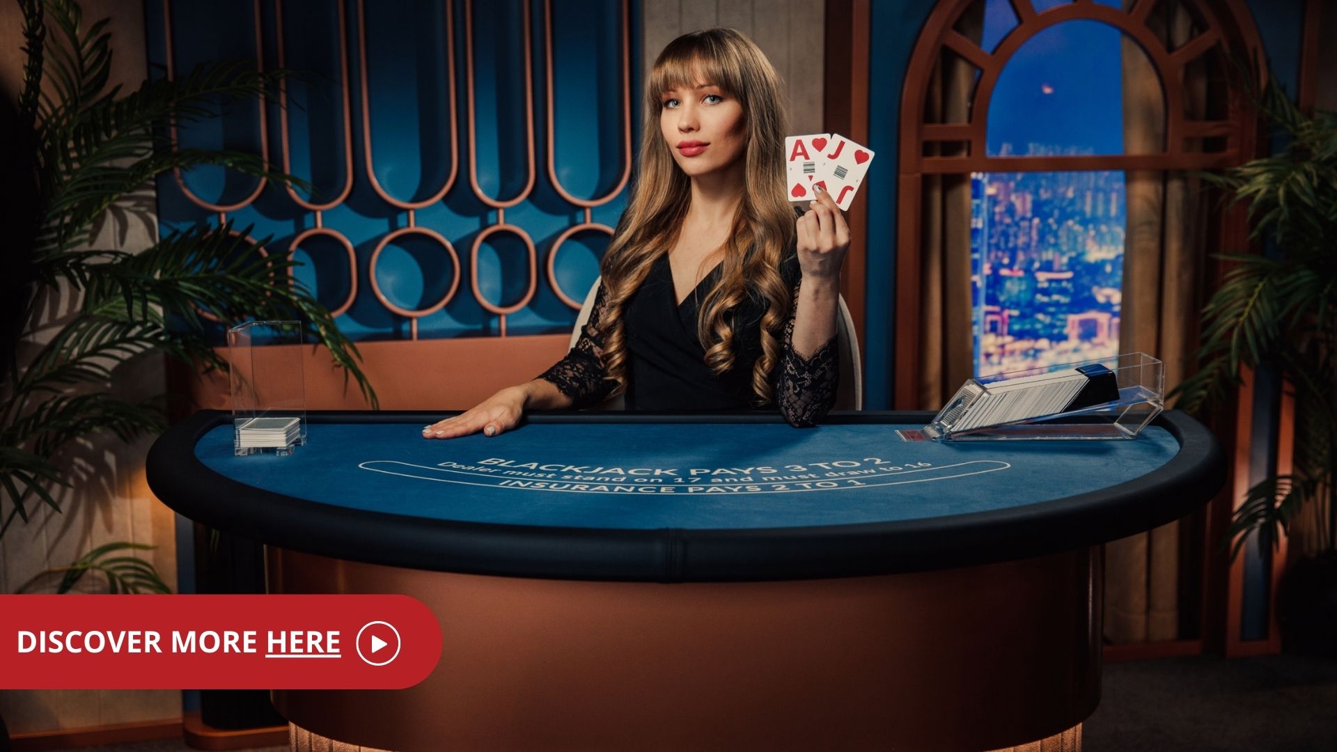 Female game presenter behind a table in Standard Blackjack reading 'discover more here'.