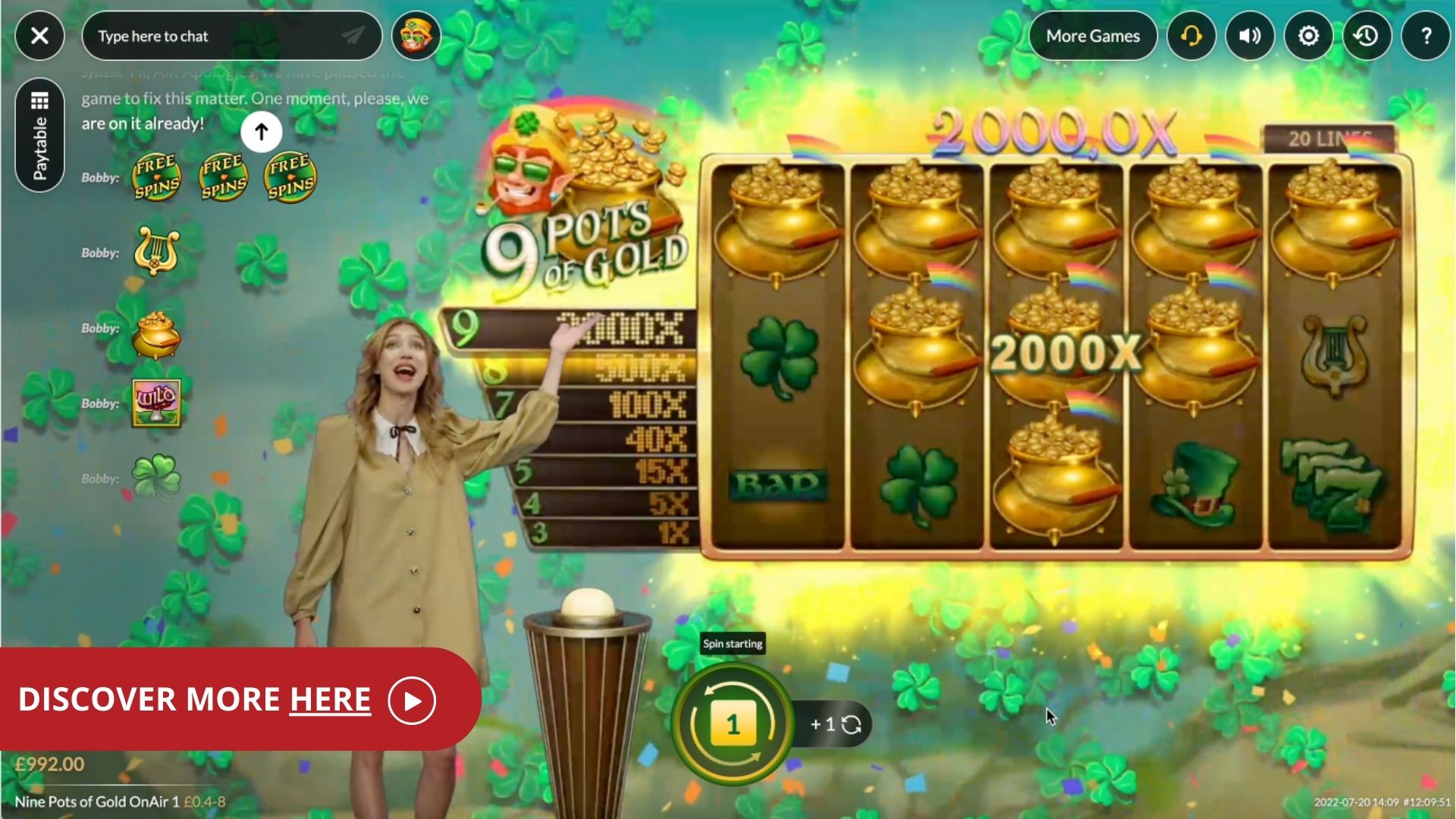 Female game presenter near the slots of 9 Pots of Gold, reading 'discover more here'.