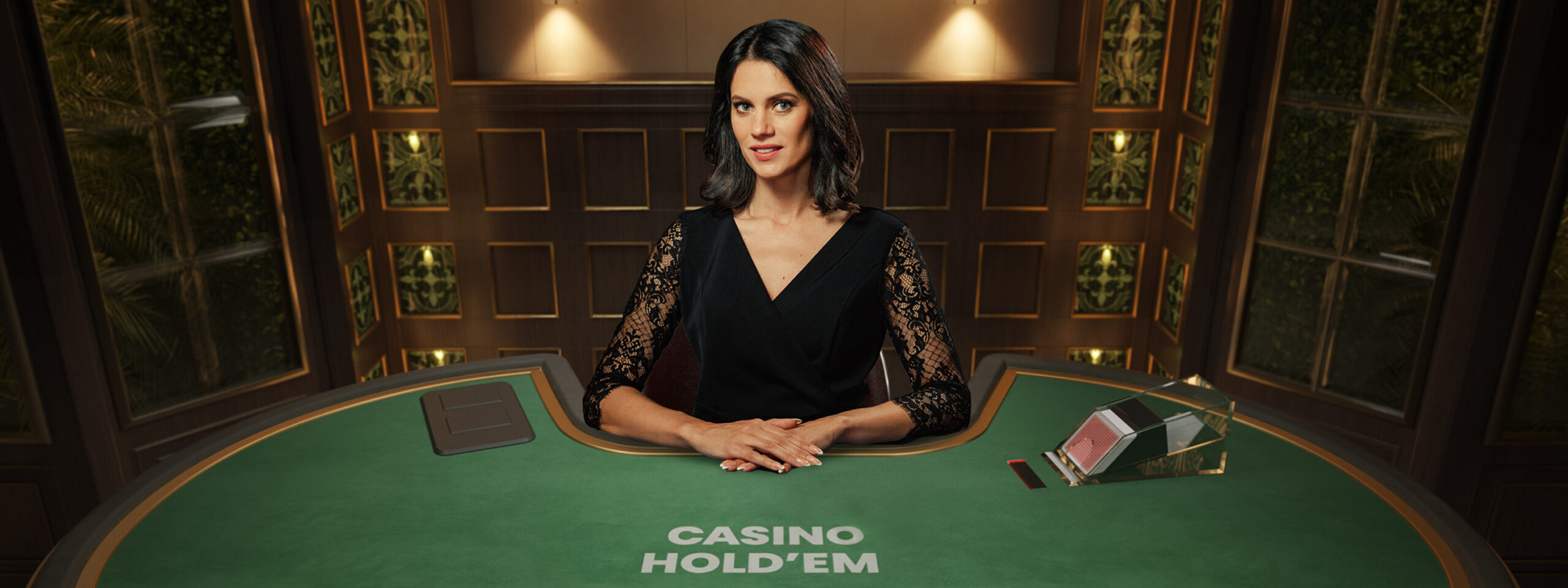 Female game presenter behind the table in a screenshot of Casino Hold'em.