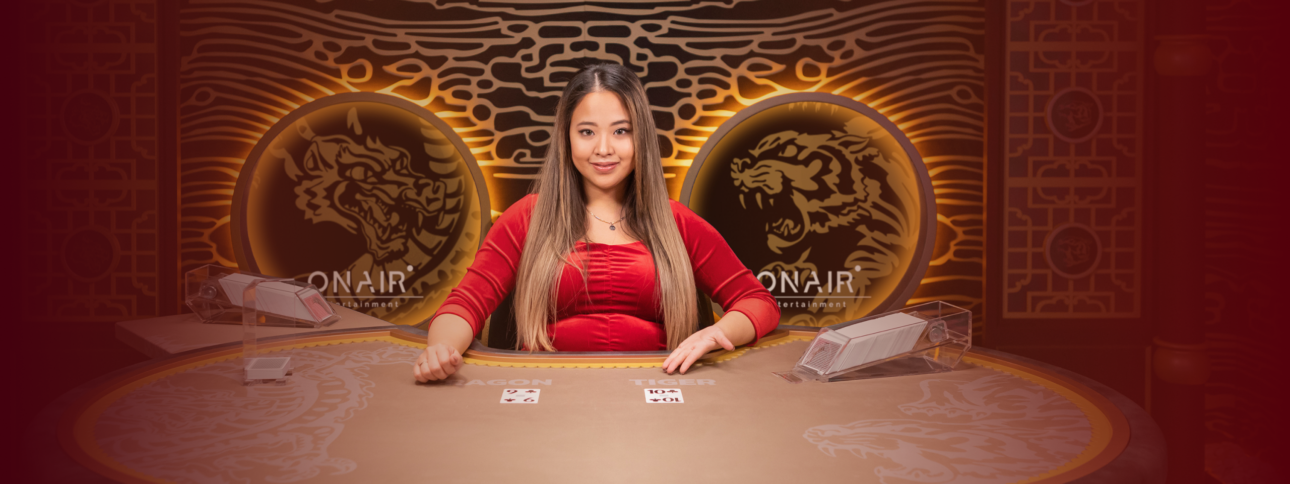 Female game presenter placing cards on the table in Blazing Dragon Tiger.